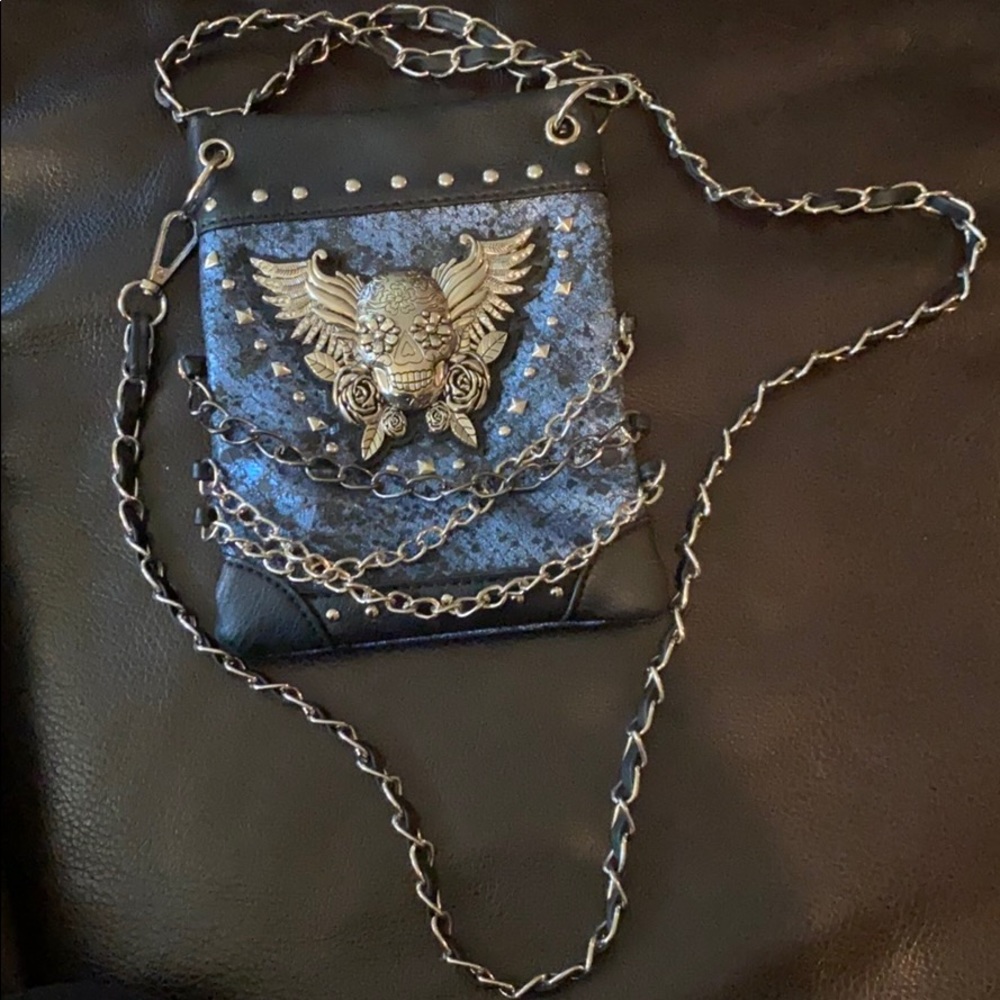 Brand new crossbody bag. Metal detail.